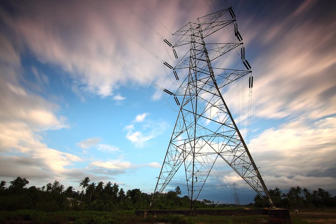 High-voltage power transmission tower under sky