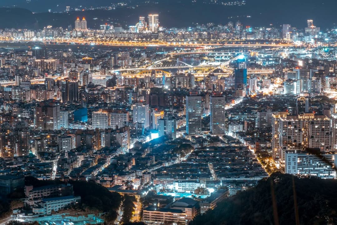 Dense city skyline glowing at night
